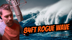Marc Scott narrating at a studio microphone beside a massive ocean wave, with bold text reading "84FT ROGUE WAVE" — thumbnail for Rogue Wave Destroys Oil Platform – The Day Science Changed, a documentary short narrated by Marc Scott